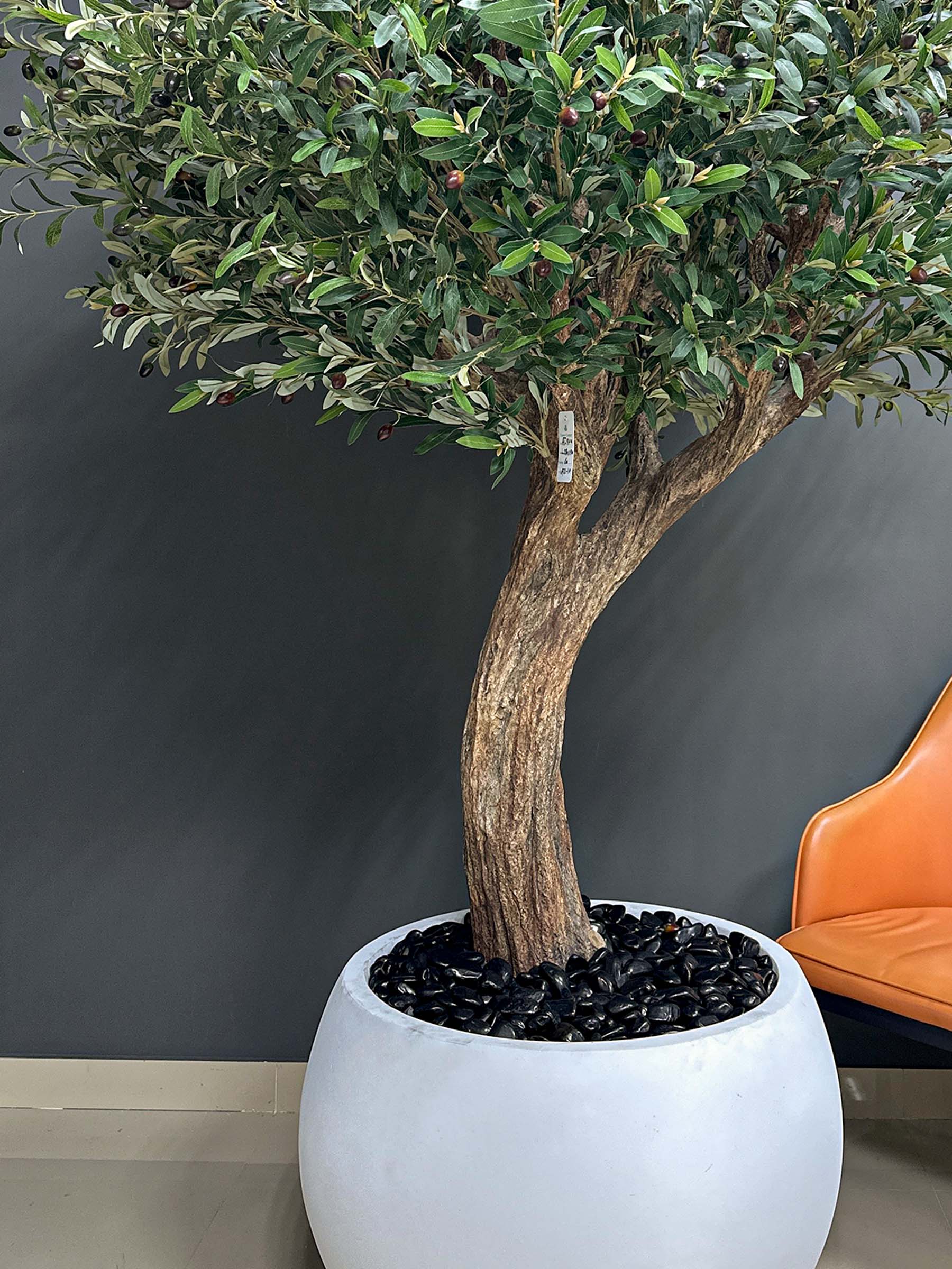 9104(2) Elevate your interior with our gorgeous Artificial Olive Tree. Enjoy the charm of nature in your home or workspace all year round!
