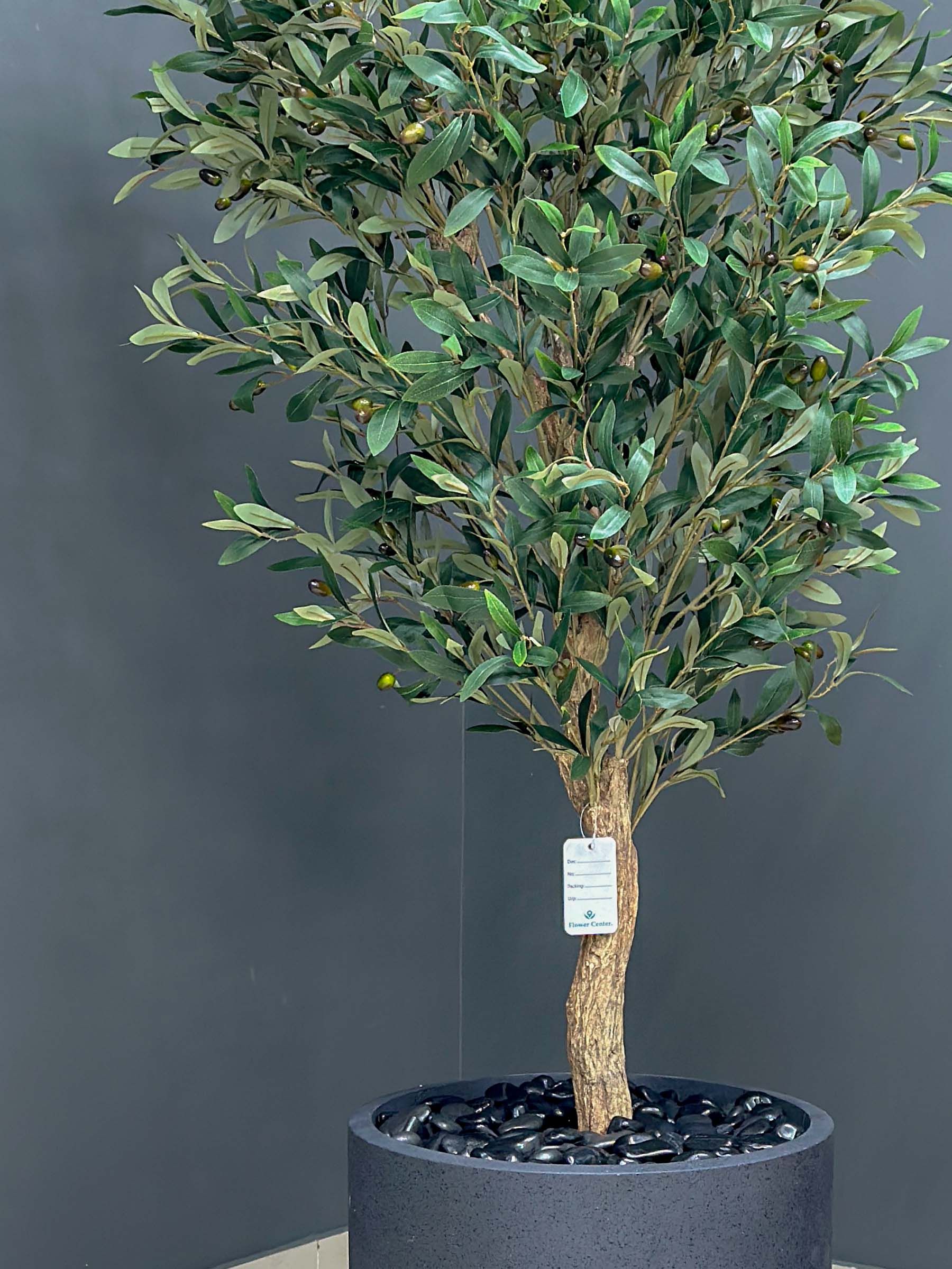 9130(1) Elevate your interior with our gorgeous Artificial Olive Tree. Enjoy the charm of nature in your home or workspace all year round!