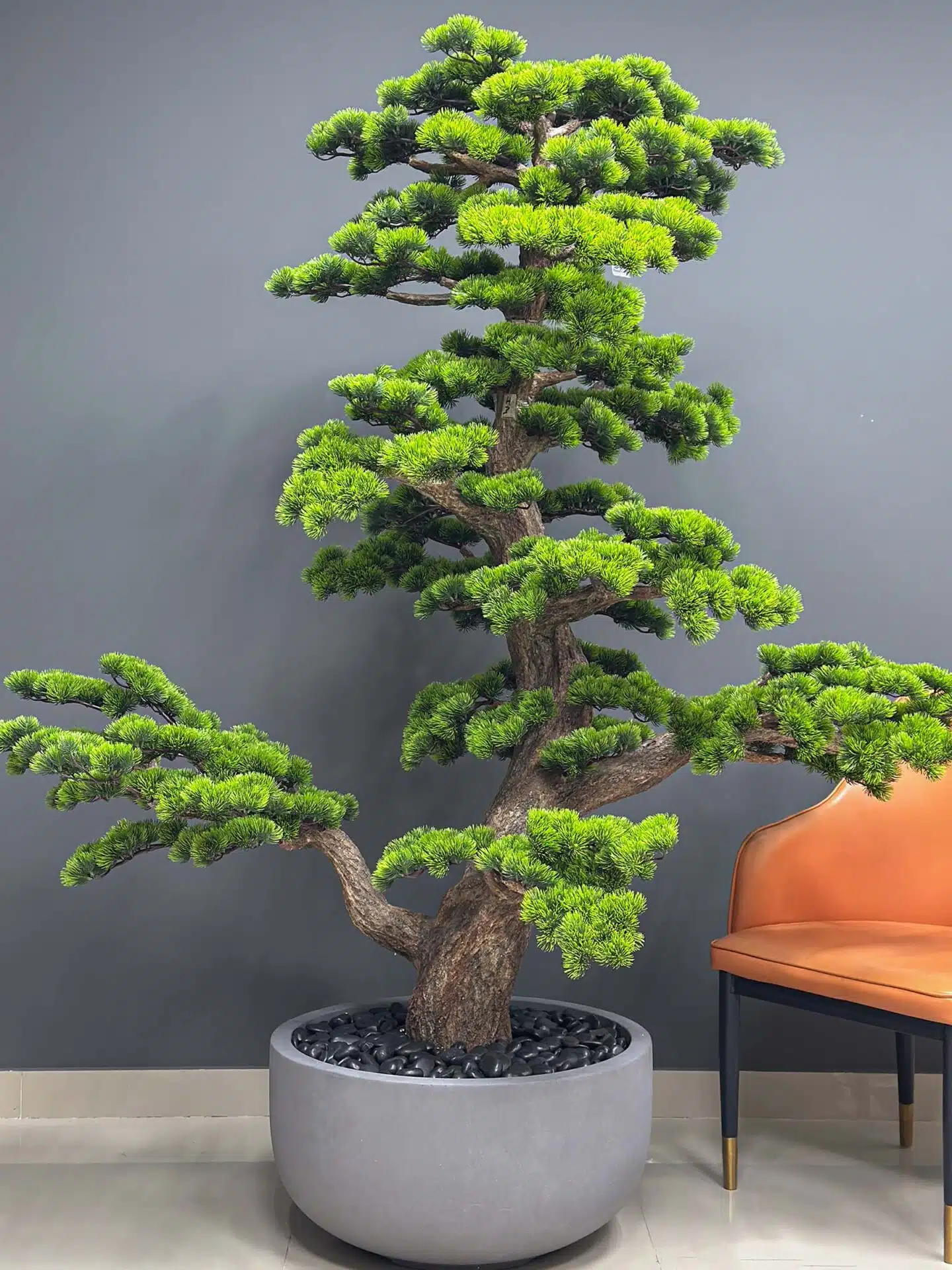 Elevate your space with this stunning Artificial Bonsai Tree! Its realistic design and stylish pot will bring everlasting beauty to any setting.