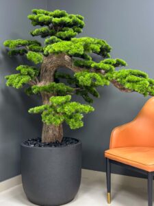 Elevate your space with this stunning Artificial Bonsai Tree! Its realistic design and stylish pot will bring everlasting beauty to any setting.