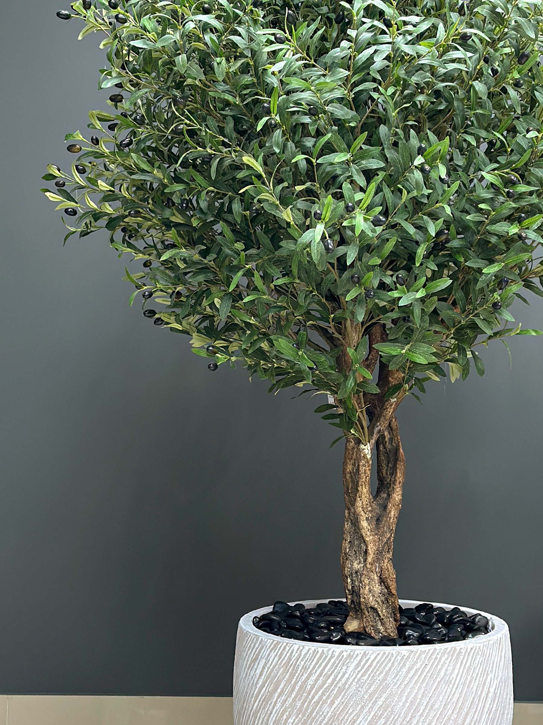 9610(2) Elevate your interior with our gorgeous Artificial Olive Tree. Enjoy the charm of nature in your home or workspace all year round!