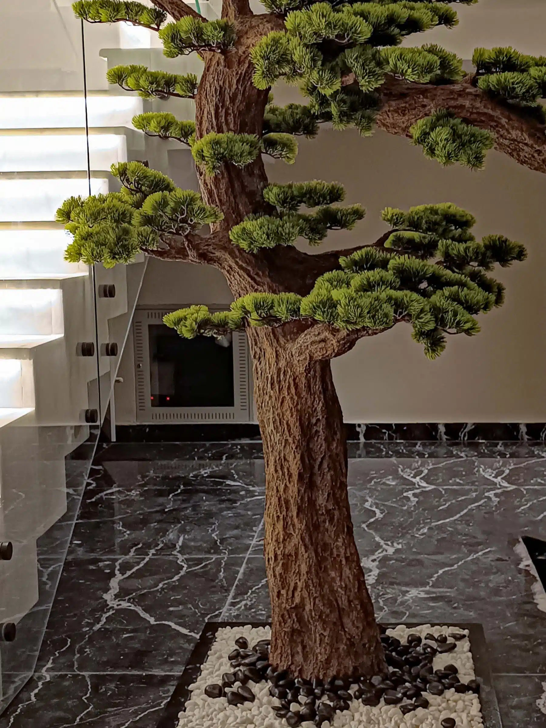 9660(2) Elevate your space with this stunning Artificial Bonsai Tree! Its realistic design and stylish pot will bring everlasting beauty to any setting.