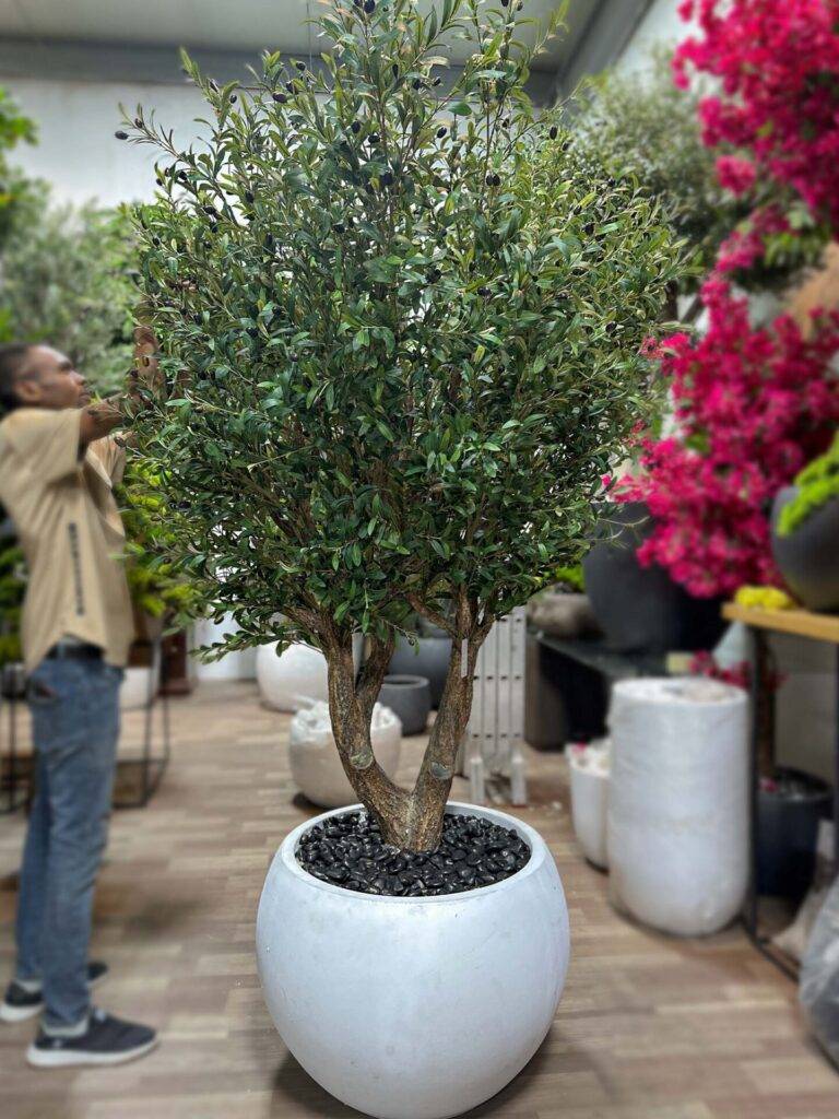 Transform your space with our stunning Artificial Olive Tree, offering timeless beauty without the hassle. Perfect for home or office decor!