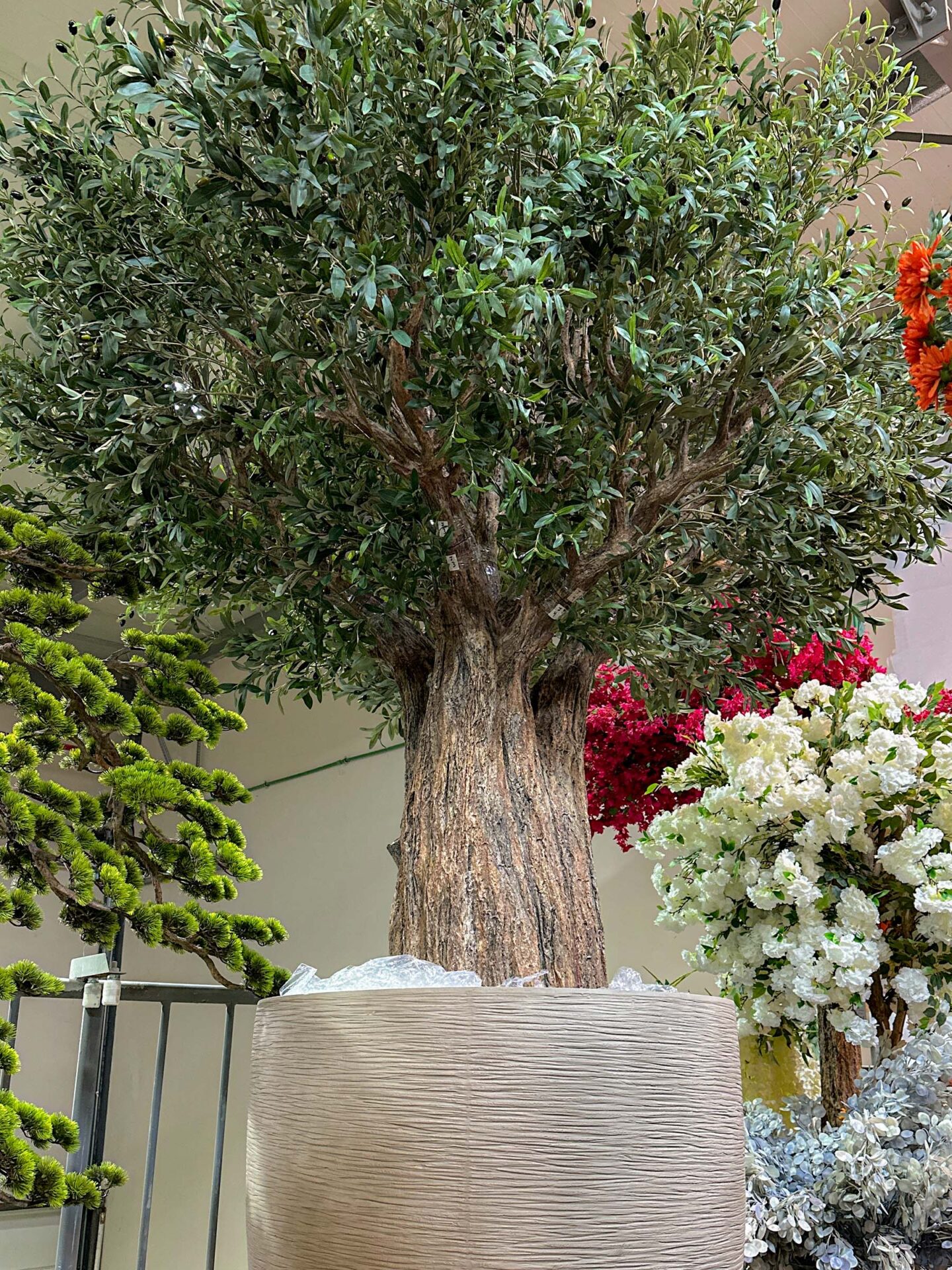 Looking for lasting beauty? The Artificial Olive Tree adds flair to any environment, whether commercial or residential. Create your oasis today!