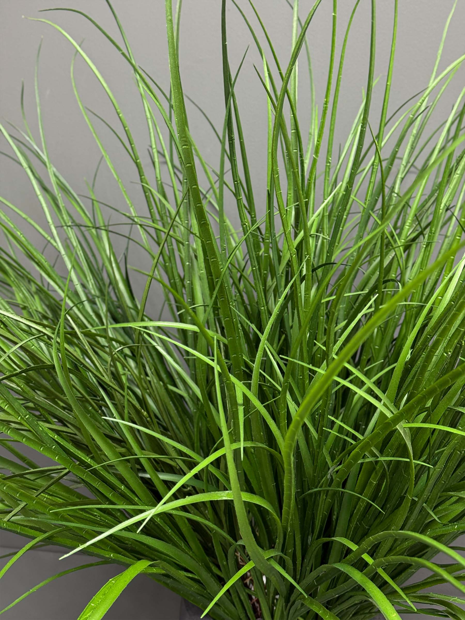 ar58-1 Add a touch of elegance to your space with the Artificial Accessories Grey Pot. Embrace everlasting beauty that requires no care!